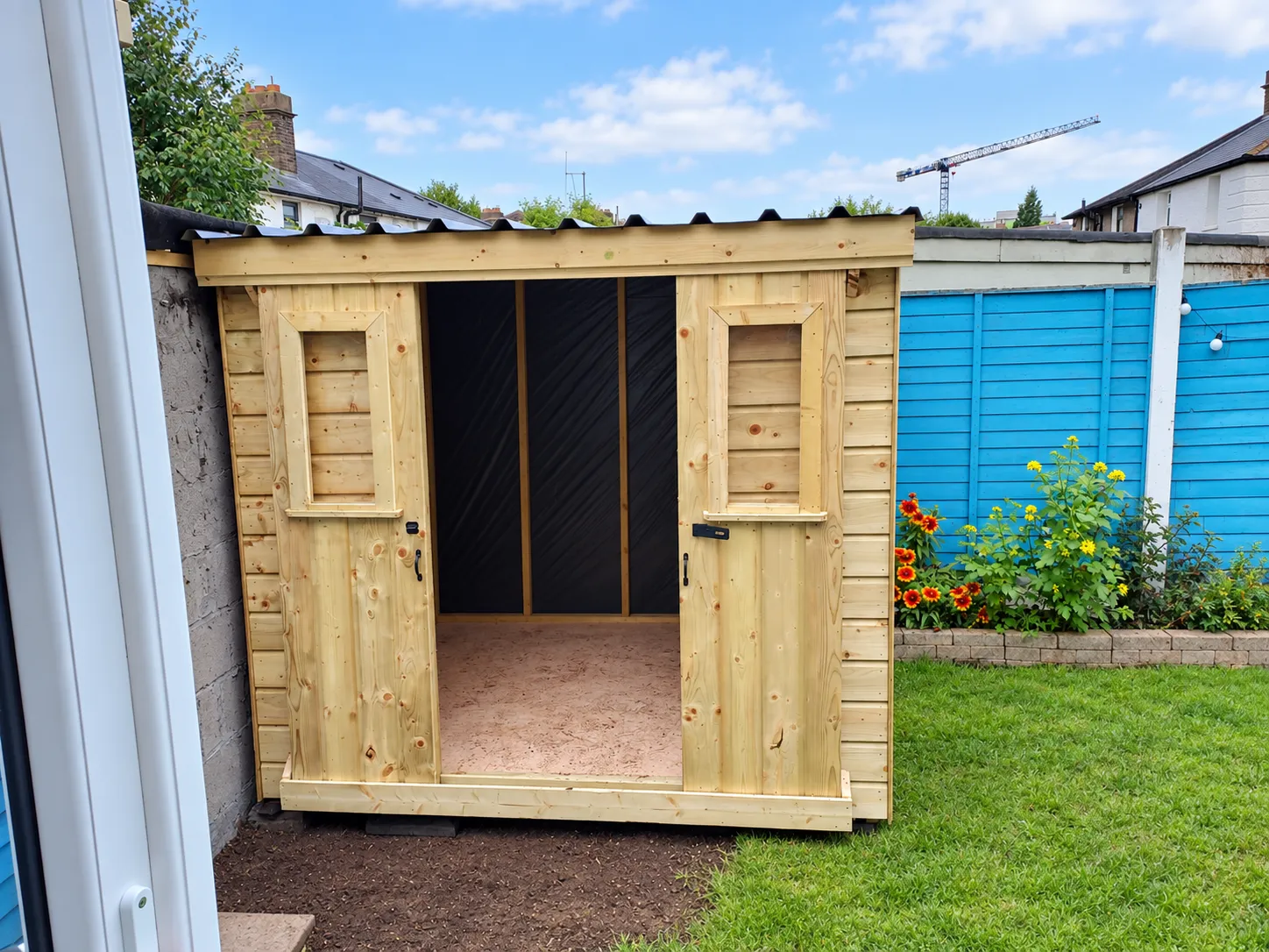 Timber storage shed with open double doors